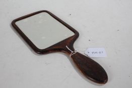 Late 19th/early 20th Century treen hand mirror, the back with a foliate design and monogram, 30.