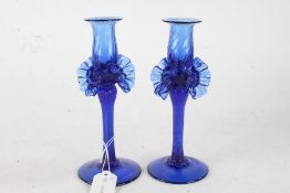 Pair of Murano blue glass candlesticks, the reeded sconces above frill decorated twisted stems, 22cm