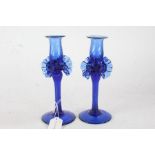 Pair of Murano blue glass candlesticks, the reeded sconces above frill decorated twisted stems, 22cm