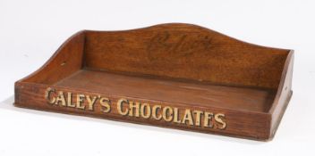 Caley's Chocolates tray. The oak tray with a shaped back and the company name above the sweeping