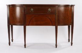 19th Century mahogany and crossbanded sideboard, the rectangular top with bowed corners above two