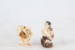 Two Japanese Meiji period carved ivory netsuke, the first in the form of a man with fish, having