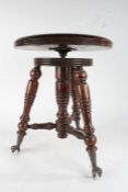 Late 19th century American beech piano stool, by Tonk of Chicago & New York, the revolving seat