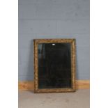 Gilt framed wall mirror, the leaf and berry decorated gilt frame housing the rectangular mirror