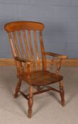 Early 20th century elm seated windsor chair, with slat back rest, raised on turned legs, 60cm wide