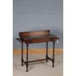 Edwardian oak washstand, the wavy upstand and top flanked by two towel rails, on bobbin turned