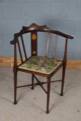 Art Nouveau corner chair, the shaped cresting rail above a foliate marquetry inlaid splat back,