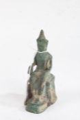 19th Century Chinese bronze deity figure, the seated figure with left hand raised, 14cm high
