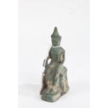 19th Century Chinese bronze deity figure, the seated figure with left hand raised, 14cm high