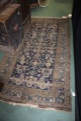 Middle Eastern style rug, the blue ground with lozenges and geometric motifs, 191cm x 105cm