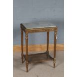 Empire style occasional table, with grey veined marble top, raised on tapering reeded legs united by