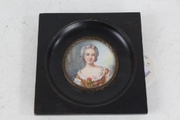 19th century hand painted miniature, depicting a lady wearing a yellow dress and holding a flower,