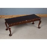 Mahogany coffee table, with scalloped rectangular top, raised on cabriole legs with claw and ball