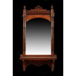 Victorian wall mirror, the moulded frieze above a bevelled mirror plate, flanked by turned