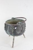 20th century copper and brass cauldron, with swing handle, the body applied with various brass