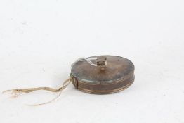 19th Century brass tape measure, marked 787 to the handle