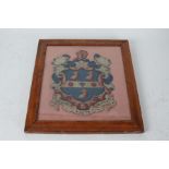 19th Century woolwork armorial picture, depicting the arms of Rugby School, housed in a glazed maple