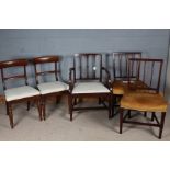 Pair of Victorian mahogany dining chairs, with reeded splat backs and over-stuffed seats, on