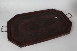 Early 20th century carved mahogany drinks tray, with chip carved decoration and brass carrying