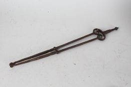 Pair of George III wrought iron fire tongs, 64cm long