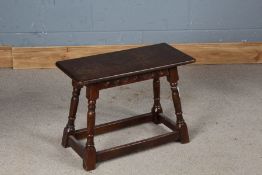 Small oak joint stool, the rectangular top raised on turned legs and flattened stretchers, 60.5cm
