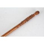 French carved wooden walking stick, carved with depictions of a stonemason surrounded by his