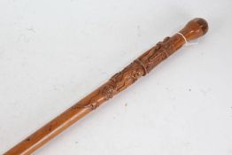 French carved wooden walking stick, carved with depictions of a stonemason surrounded by his