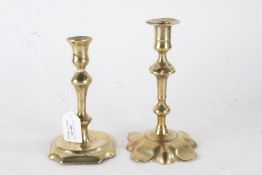 Two 19th Century brass candlesticks, with tapering baluster stems, 19cm and 17cm high (2)