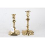 Two 19th Century brass candlesticks, with tapering baluster stems, 19cm and 17cm high (2)