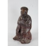 20th century Chinese pottery figure, of a bearded gentleman, with a brown glaze, 33cm tall