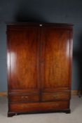 Victorian mahogany wardrobe, the stepped pediment above two panelled cupboard door and frieze