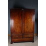 Victorian mahogany wardrobe, the stepped pediment above two panelled cupboard door and frieze