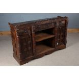 Rajasthani sideboard, the carved frieze above a central open recess with shelf flanked by two