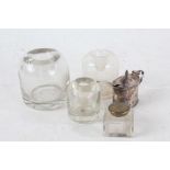 Three Victorian glass circular ink bottles, and a square inkwell smaller, and an early 20th