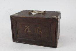 Early 20th century Chinese Mah-Jong set, housed within a hardwood and silvered metal mounted box,