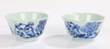 Pair of Chinese tea bowls, Qing dynasty, each circular bowl painted with flowers in blue on a