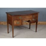 Edwardian mahogany bow front side table, the reeded frieze above a single long drawer and two