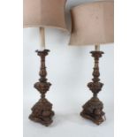 Pair of Rococo style carved gilded wooden table lamps, the semi-circular shades above an acanthus