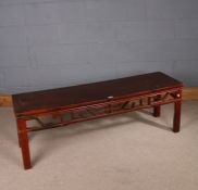 Chinese painted softwood table, of low rectangular form, the top above a carved pierced frieze and