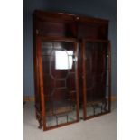 Edwardian mahogany ebony and boxwood strung bookcase, the two astragal glazed doors opening to