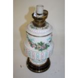 Victorian porcelain oil lamp (converted to electricity), the lift out font above a lattice body