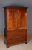 George III mahogany converted linen cupboard, the moulded cornice above a pair of panelled doors