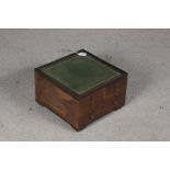 Mid 20th Century mahogany sewing cabinet, the green tooled leatherette above an arrangement of