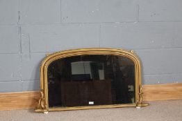 Regency style gilt framed over mantle mirror, having arched frame with porcelain feet, 94.5cm wide