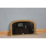 Regency style gilt framed over mantle mirror, having arched frame with porcelain feet, 94.5cm wide