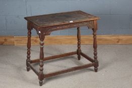 Small oak occasional table, the demi-lune carved top raised on turned legs and flattened stretchers,