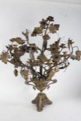 20th century brass nine branch candelabra, having ornately applied flowers, leaves and grape