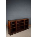 Mahogany open bookcase, with down-swept pediment and open recesses, on a plinth base, 180cm wide