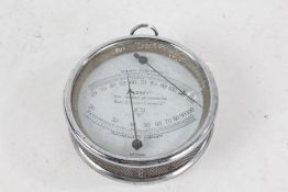 Edney Thermo Hygrometer, No. 9448, in chrome case, 14.5cm diameter