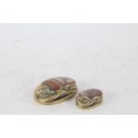 Two Egyptian revival brass Scarab Beetles, each with white metal inlay and hieroglyphics (2)